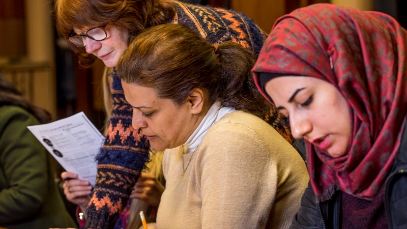 Learners sitting at table