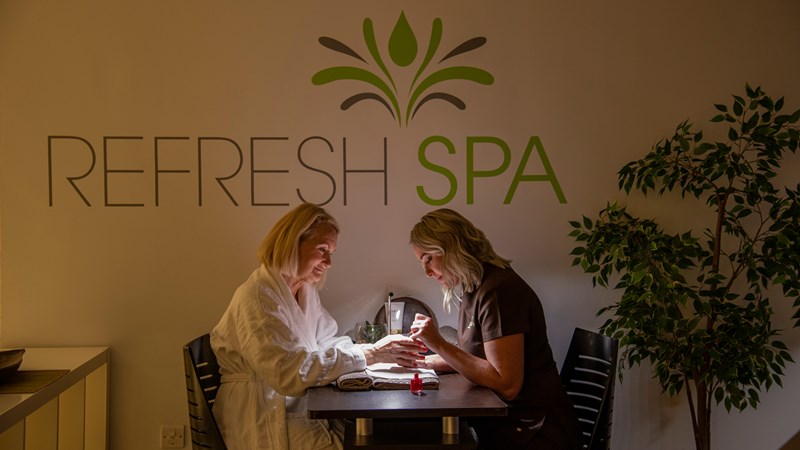 Person getting nail treatment at Refresh Spa