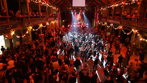 Large crowd at Old Fruitmarket music venue with atmospheric lighting